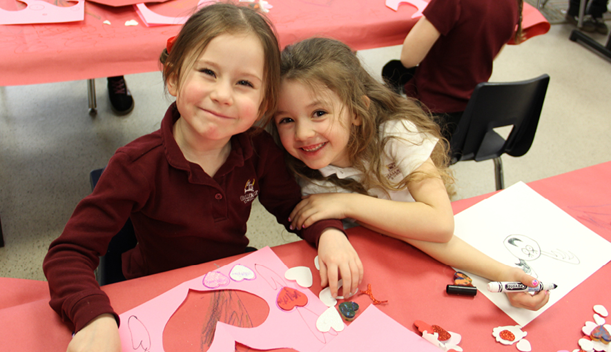 Two smiling Challenger students enjoying Valentine’s Day celebrations